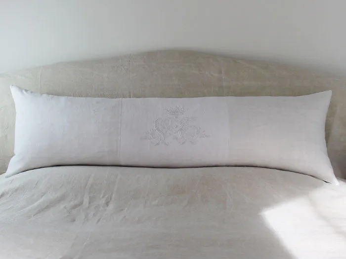 A rare antique monogram 'VC' with crown on linen bolster by Charlotte Casadéjus