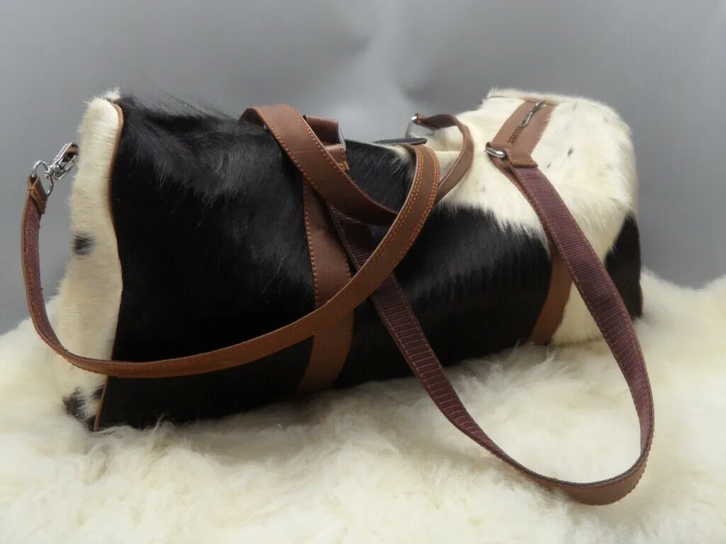 Custom made cowhide duffel bags.