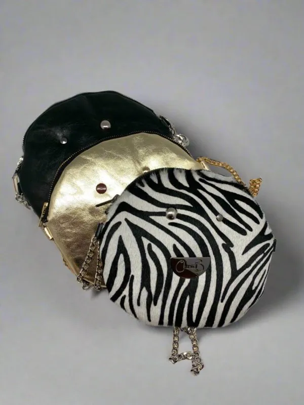 Muse wonky eye chain gold-animal cow handbag