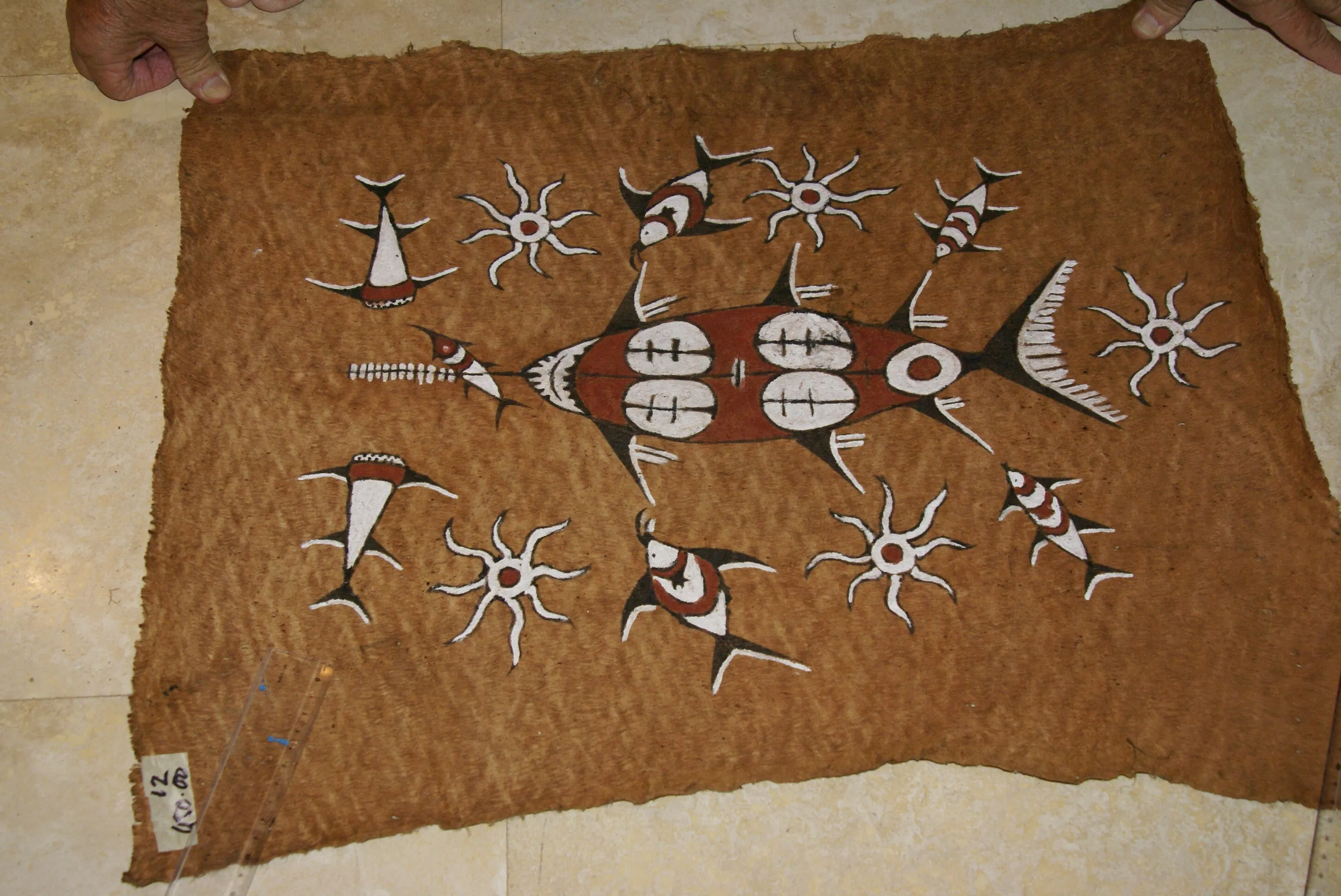 Rare Tapa Bark Cloth (Kapa in Hawaii), from Lake Sentani, Irian Jaya, Papua New Guinea. Hand painted by a Tribal Artist with natural pigments: Spiritual Stylized Sword fish, Fish, Star fish Motifs 26" x 21" (no 12)